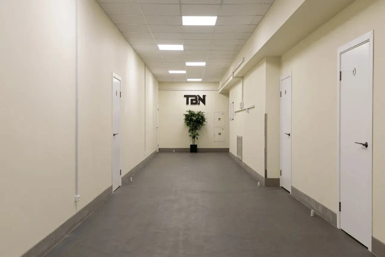 Modern facility corridor with logo