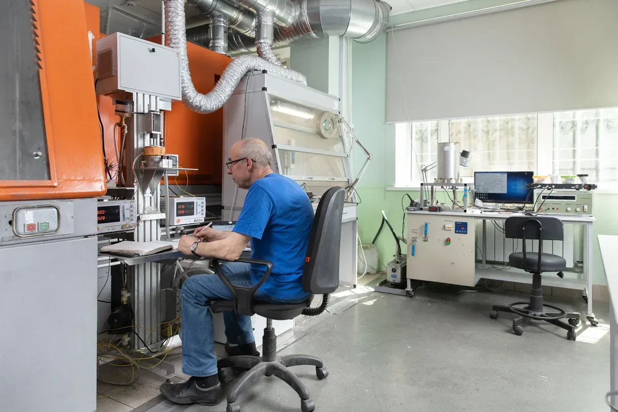 Worker operating laboratory equipment